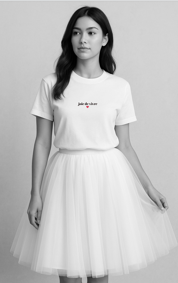 Minimalist Joie de Vivre t-shirt with subtle red heart design, styled with a soft white tulle tutu like skirt - part of the Meaningful Minimalism collection.
