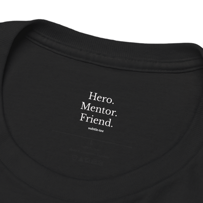 Hidden collar message inside black T-shirt reading “Hero. Mentor. Friend.” from Subtletee, a heartfelt token of gratitude and appreciation.